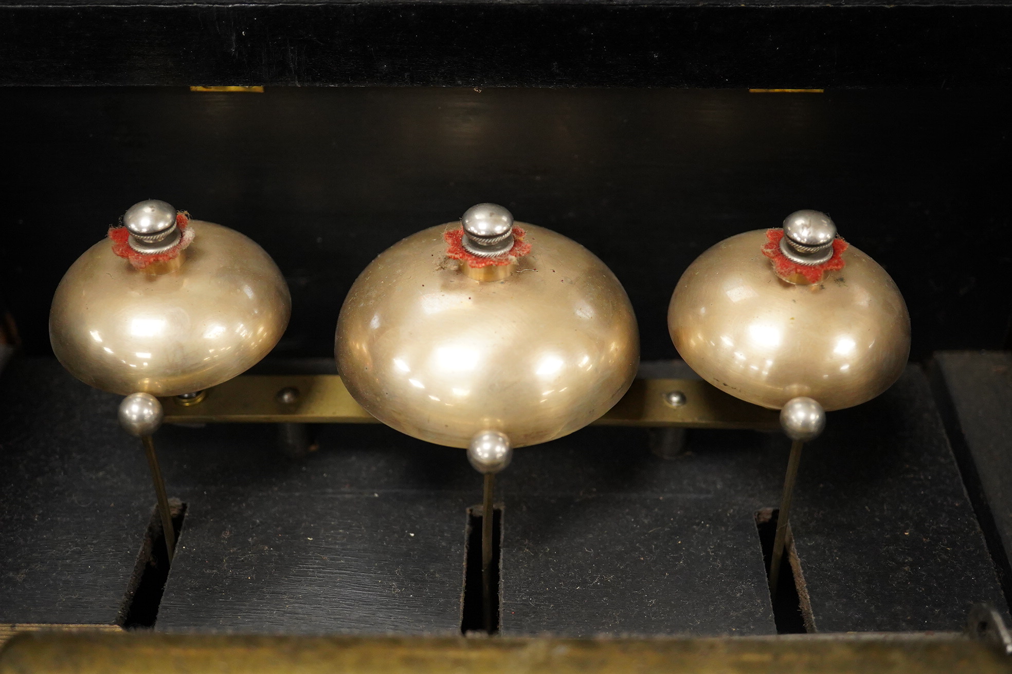 A mid-19th century inlaid and ebonised rosewood Swiss cylinder music box playing eight airs on a cylinder and three bells, card label to the inside of the lid listing the airs, complete with all teeth to the comb, cylind